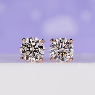 4 Carat Diamond Stud Earrings with a classic diamond prong setting.