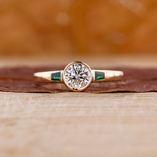Three stone engagement ring featuring sparkling lab grown diamonds on a sleek band.
