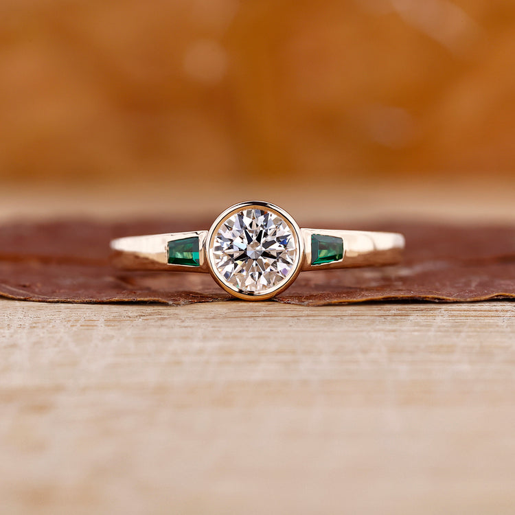 Three stone engagement ring featuring sparkling lab grown diamonds on a sleek band.
