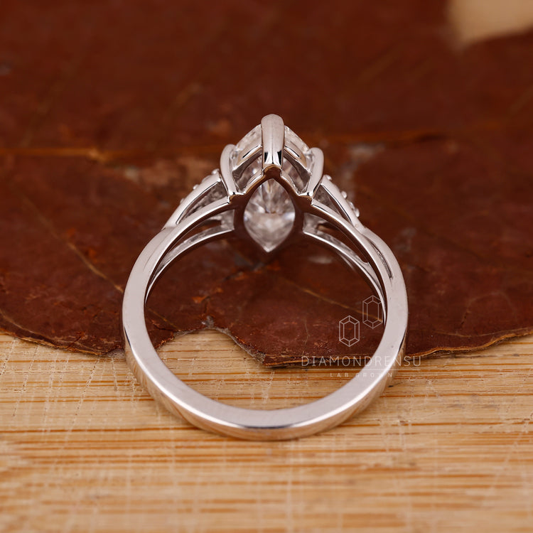 Buy engagement ring with marquise cut diamonds in white gold.
