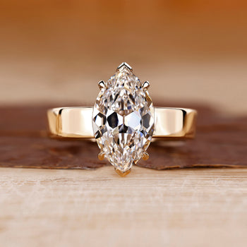 Old European cut diamond ring in yellow gold solitaire setting.
