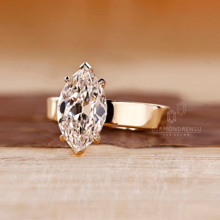 Four claw prong ring featuring Old European cut diamond and custom design.

