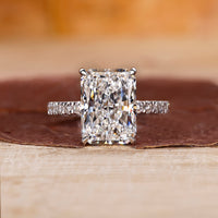 Radiant cut diamond engagement ring featuring a beautiful center stone in a classic design.
