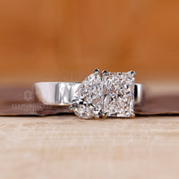 Custom diamond ring with pear and radiant Toi et Moi design.

