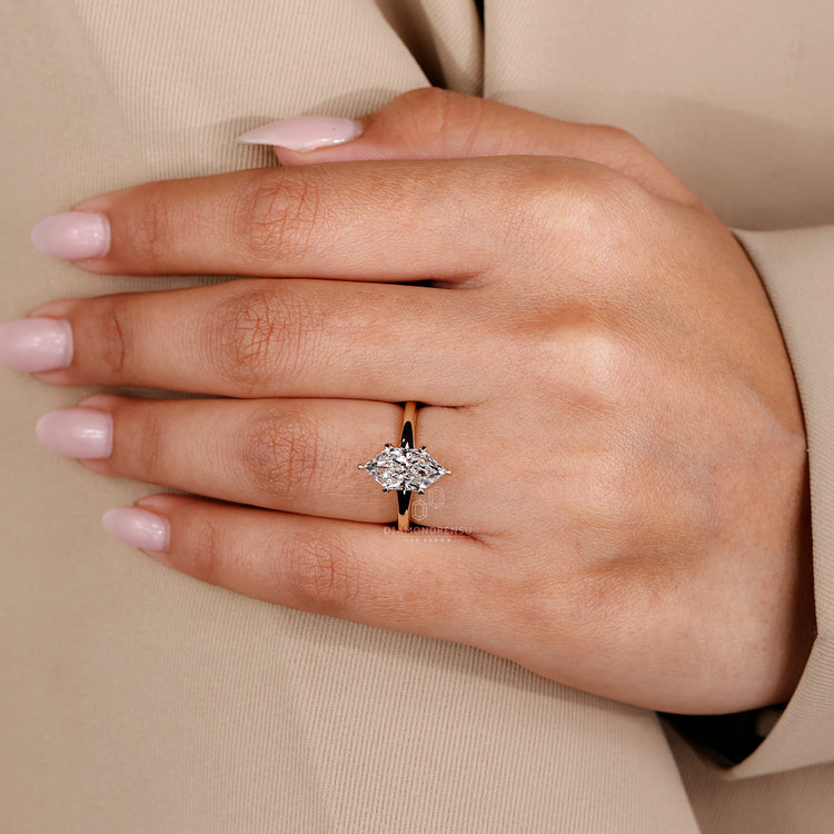 Handmade ring with Dutch marquise ring, yellow gold engagement ring, and IGI certified lab grown diamond.
