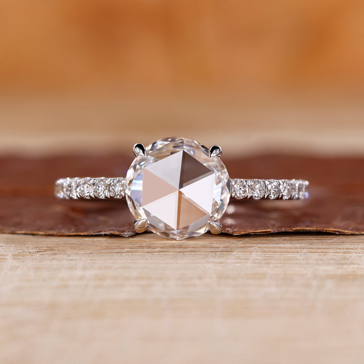 Rose cut engagement ring featuring round rose cut diamond in white gold.
