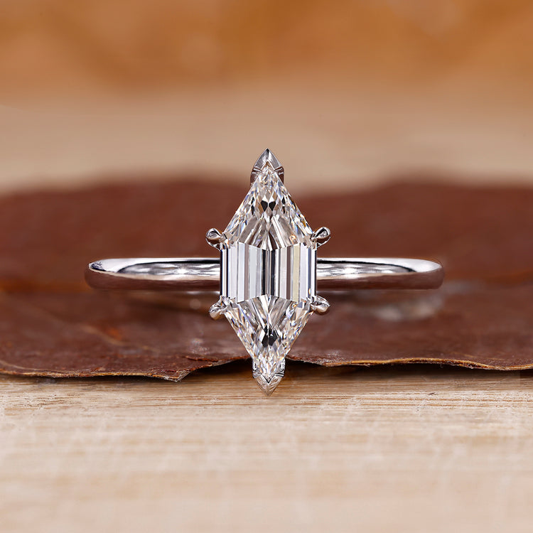 Long hexagon cut engagement ring featuring a beautiful solitaire design.
