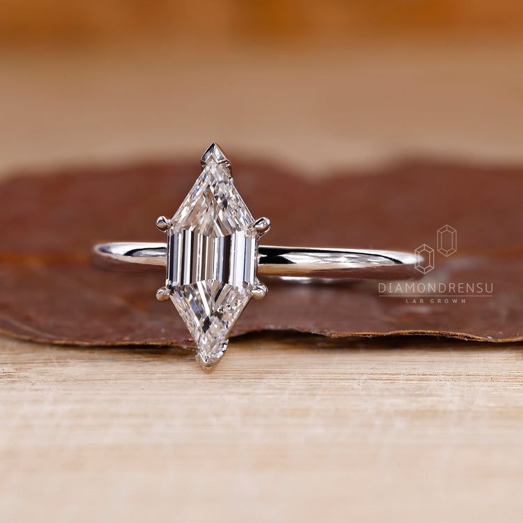 V shaped prong setting holding the diamond with care.
