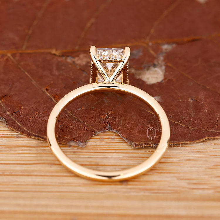 Handmade jewelry ring with radiant cut diamond in round cut hidden halo.
