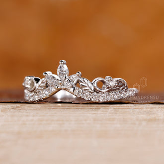 Nature-inspired wedding band with round diamonds and half eternity design.
