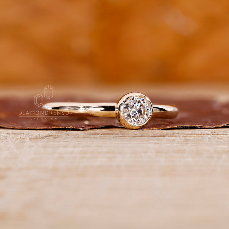A custom engagement ring with a lab grown diamond center.
