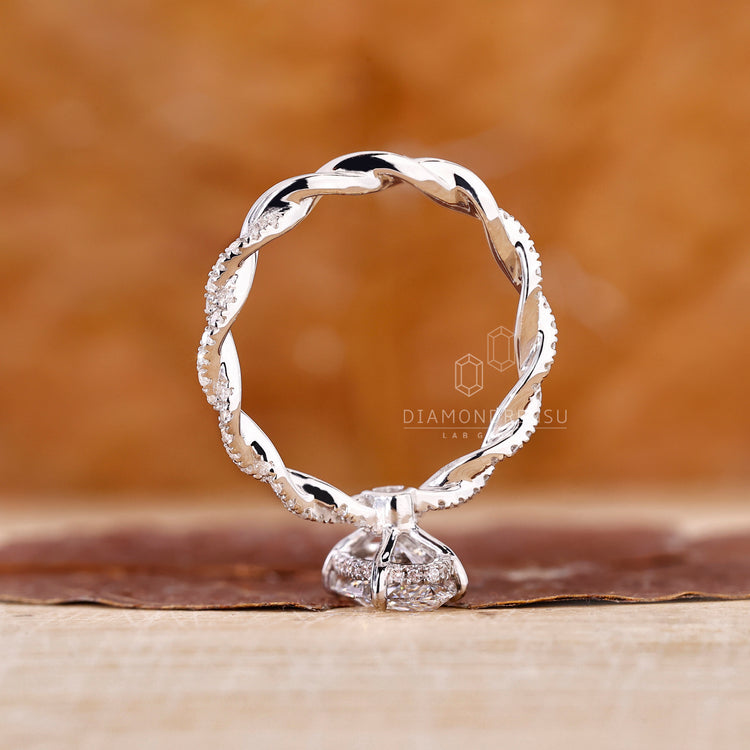Diamondrensu Engagement Ring worn on a hand highlighting the detailed craftsmanship.
