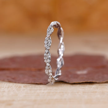 Twisted Wedding Band with round diamonds set in a white gold full eternity design.
