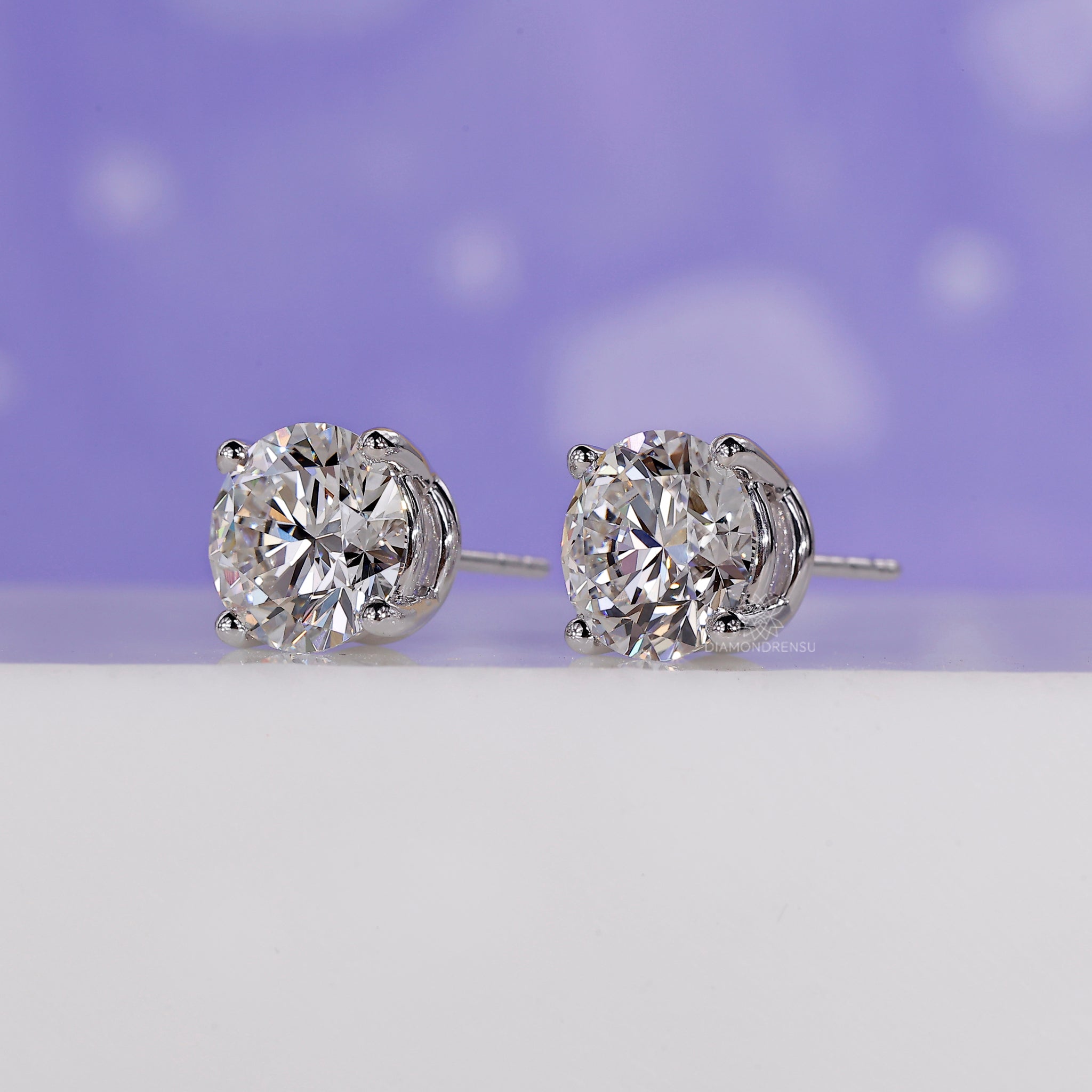 Stud earrings for men in an IGI certified 4 carat diamond studs setting.