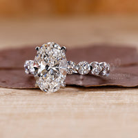 4 claw prong setting holds the center diamond securely and beautifully.
