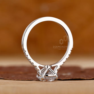 Diamondrensu engagement ring featuring a 4 prong round diamond setting.
