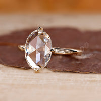 Yellow gold engagement ring with a classic 4 prong claw setting.
