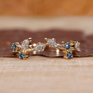 Marquise and round wedding band designed as a cluster wedding band.
