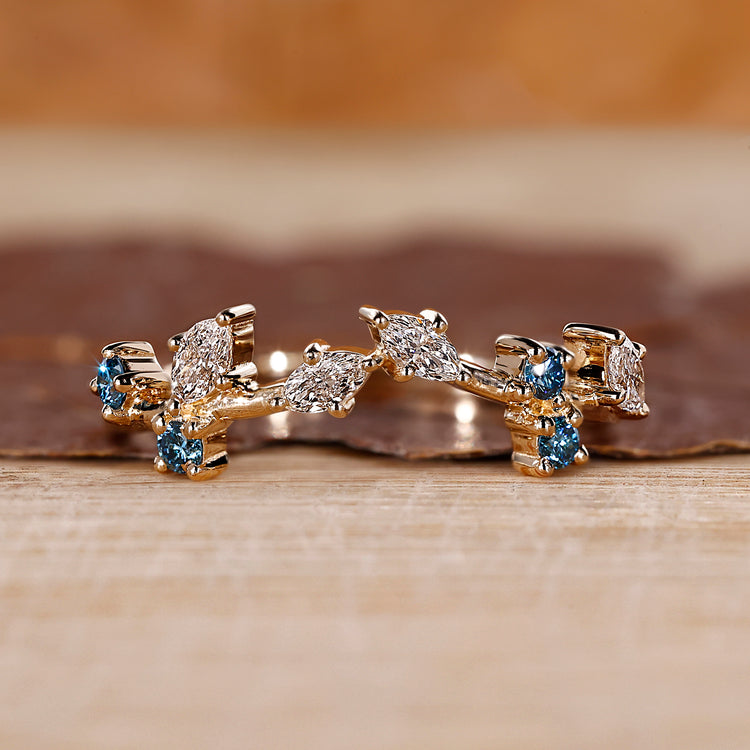 Marquise and round wedding band designed as a cluster wedding band.
