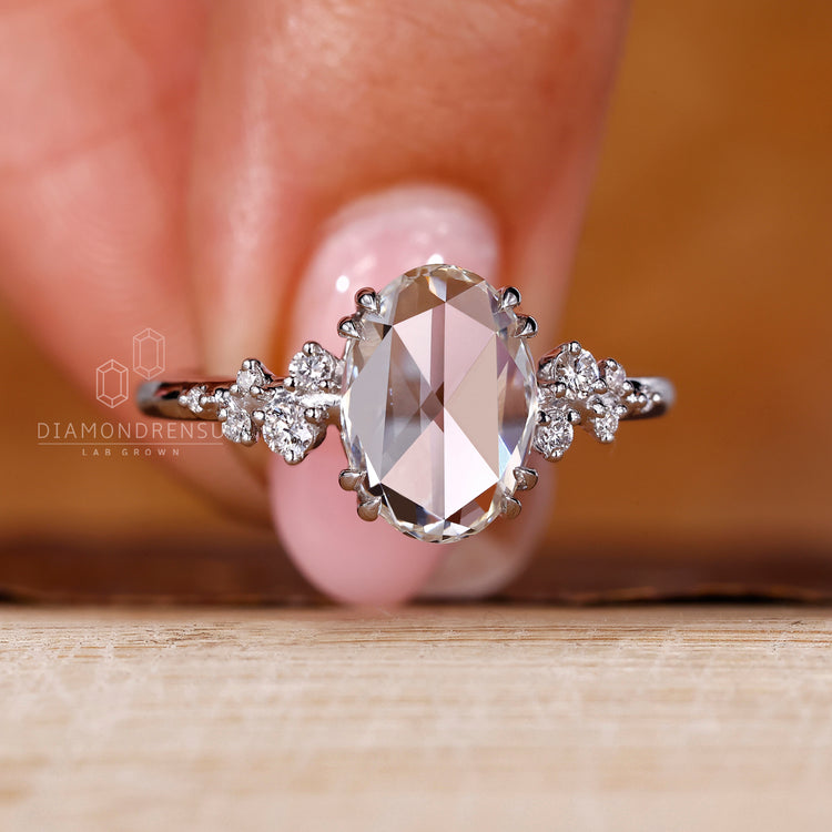 Custom diamond ring with oval rose cut diamond and cluster setting.
