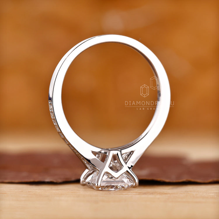 IGI certified round cut engagement ring with cathedral setting.
