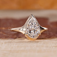 Bezel Type Prong Setting crafted for pear diamond ring.
