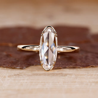 Yellow gold engagement ring with moval rose cut ring.
