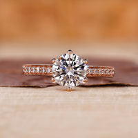A rose gold round engagement ring with a classic look
