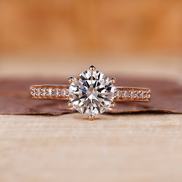A rose gold round engagement ring with a classic look
