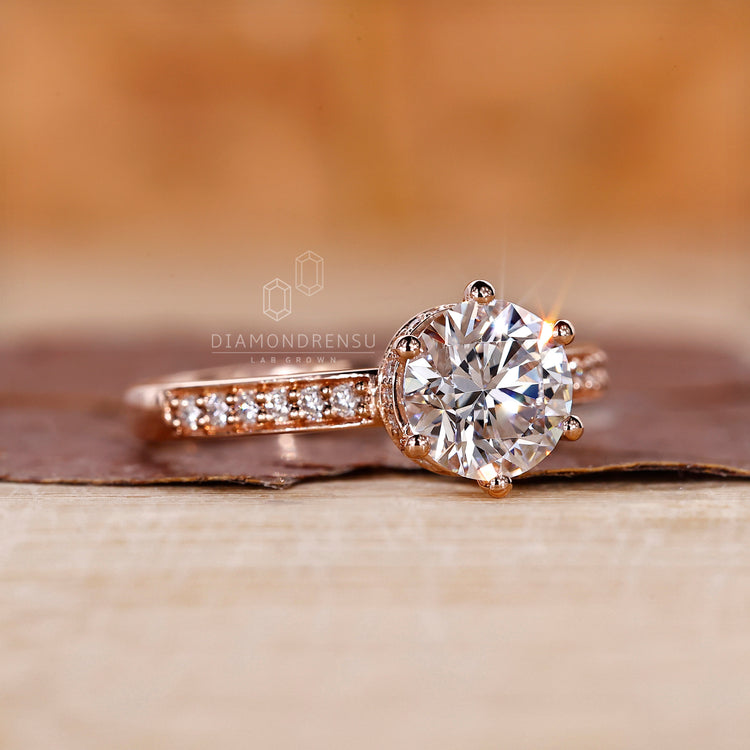 A diamond ring with a round center stone
