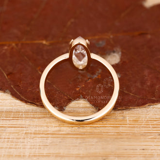 Moval rose cut ring with double prong setting.
