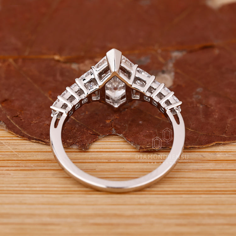 Handmade ring with V prong Dutch marquise centerpiece

