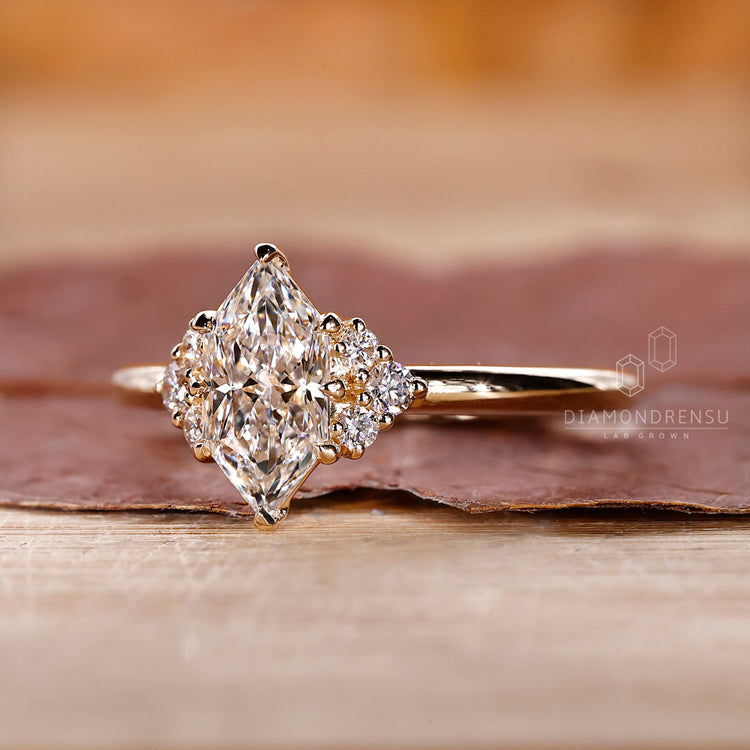 Yellow gold solitaire engagement ring with lab grown diamond.
