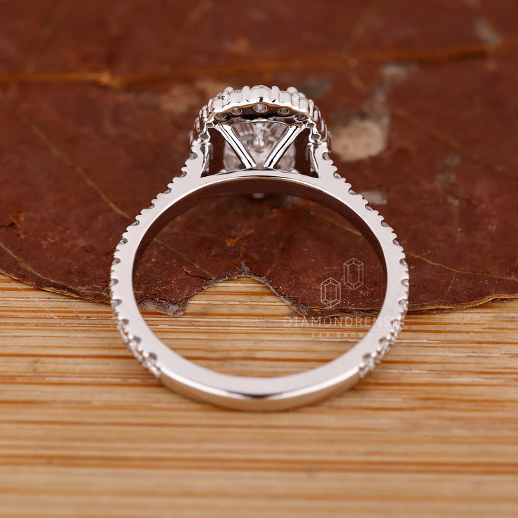 Pave setting ring with elongated cushion diamond and handmade precision.
