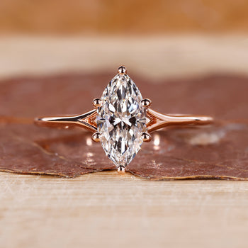 Marquise diamond ring with a split shank design.

