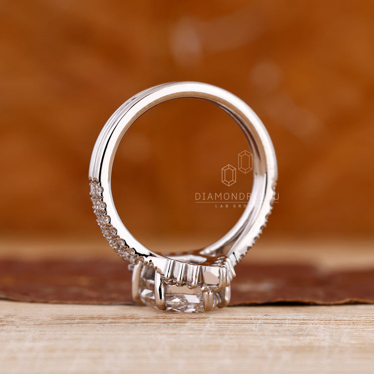 IGI certified elongated hexagon engagement ring with double curved band.
