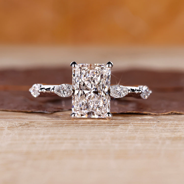 Radiant cut diamond ring with hidden halo in white gold setting.
