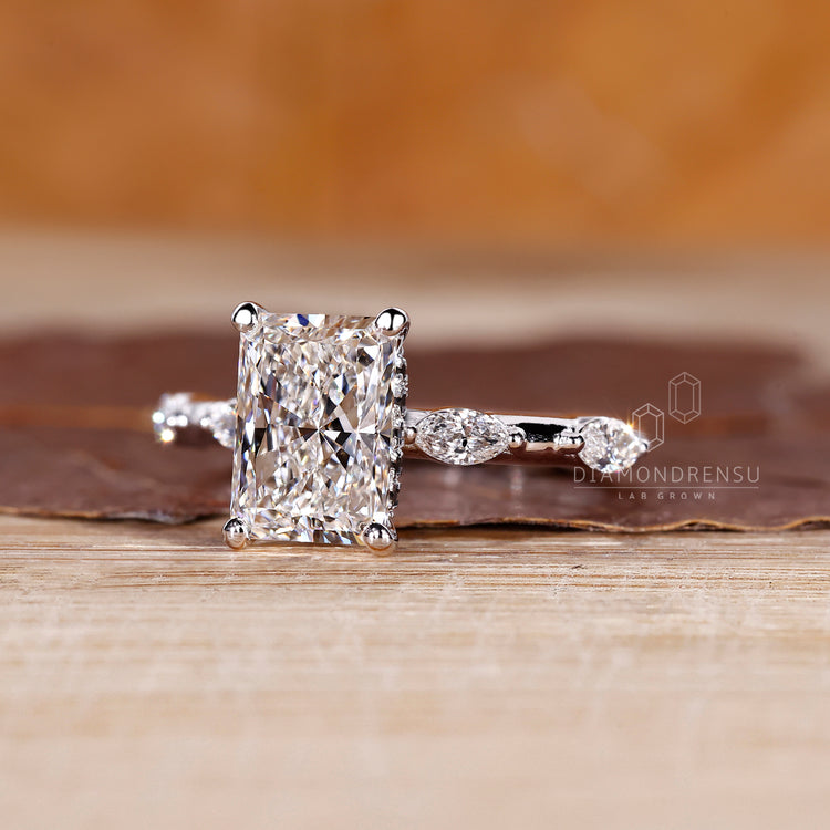 Marquise cut distance pave with radiant cut diamond in custom design.
