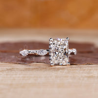 Black diamond hidden halo ring with radiant cut diamond in white gold.

