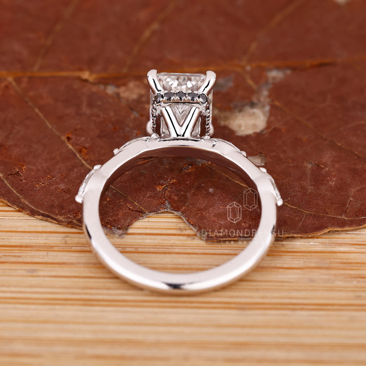 Buy engagement ring featuring radiant cut diamond and black hidden halo.
