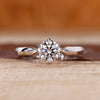 Round diamond solitaire engagement ring with tapered shank and six claw prong.

