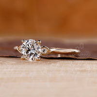 Custom diamond ring with three stone arrangement and cathedral design.

