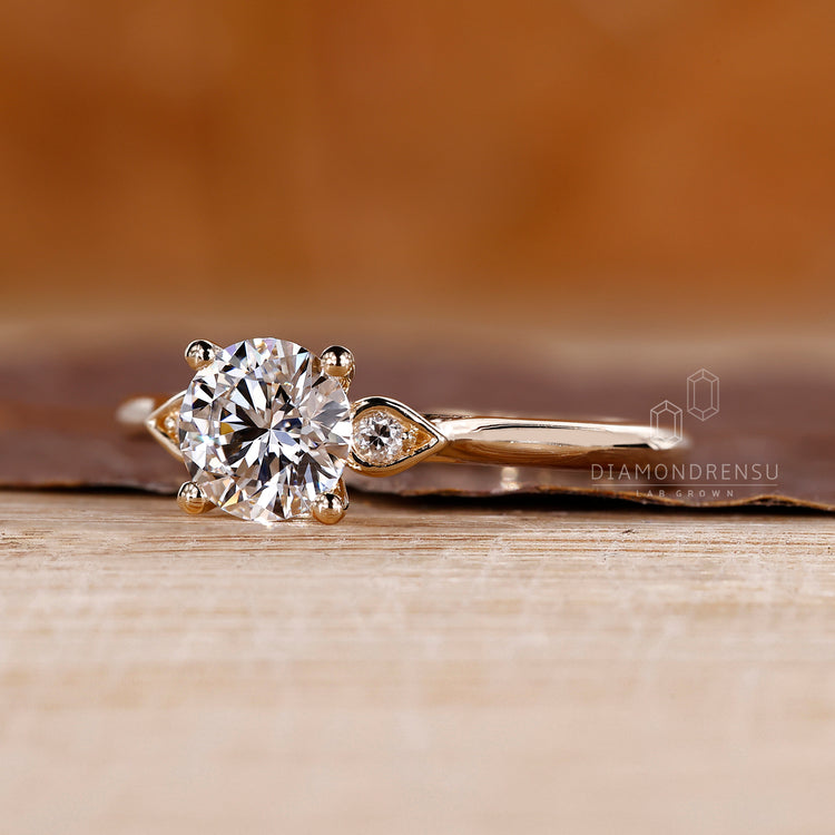Custom diamond ring with three stone arrangement and cathedral design.
