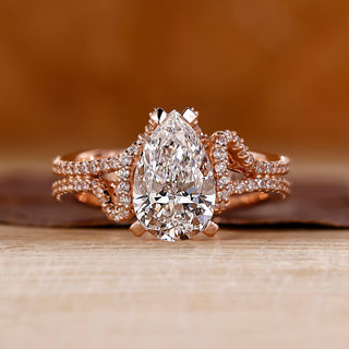 Pear cut diamond ring with pave setting ring.
