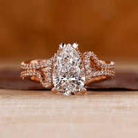 Pear cut diamond ring with pave setting ring.
