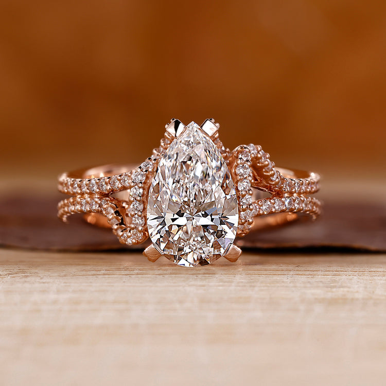 Pear cut diamond ring with pave setting ring.
