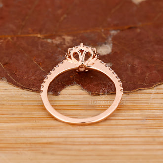 Round cut halo diamond ring in rose gold handmade jewelry.
