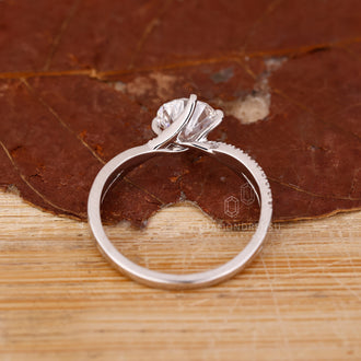 Handmade ring crafted with twisted pave design in white gold.
