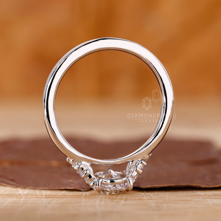 Handmade ring with oval diamond and a tapered shank design.

