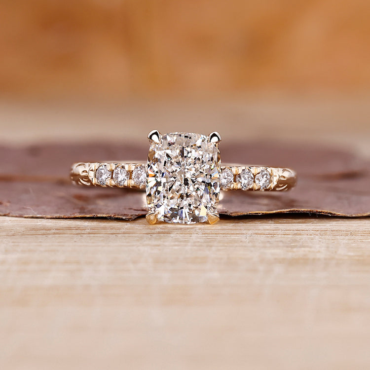 Cushion cut hidden halo engagement ring with lab grown center diamond.
